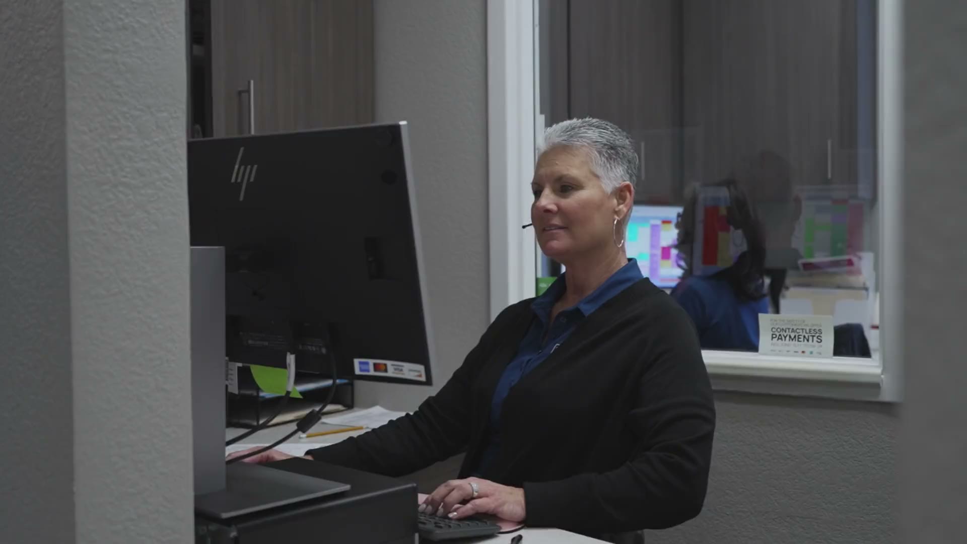 A team member working at the front office of The Dental Studio of Midland
